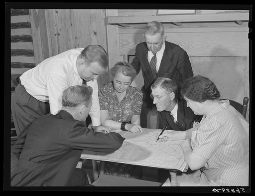Untitled photo, possibly related to: Meeting of the neighborhood or community land use planning committee in Locust Hill. Studying and working on the map of Caswell County are Walter H. Williamson, also chairman of FSA (Farm Security Administration) tenant purchase committee; J.E. Zimmerman, county 