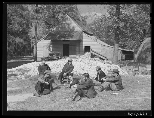 Untitled photo, possibly related to: Resting after dinner following a corn shucking on Hoopers' farm in Corbett Ridge section. Caswell County, North Carolina