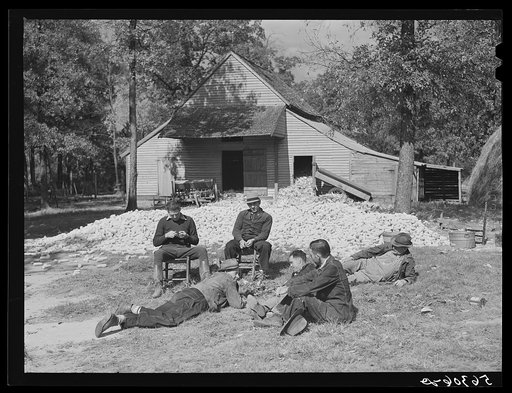 Farmers who have just finished shucking corn resting after large dinner on Hooper's farm near Hightowers and Prospect Hill. Caswell County, North Carolina