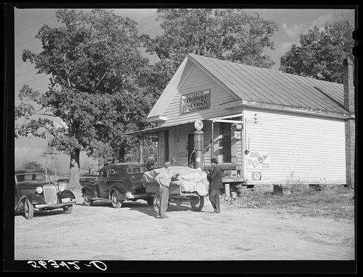 Untitled photo, possibly related to: Farmer with load of tobacco which he is taking to market to be sold at auction in warehouse. This is in front of Carver's store. Corbett Ridge section, Caswell County, North Carolina