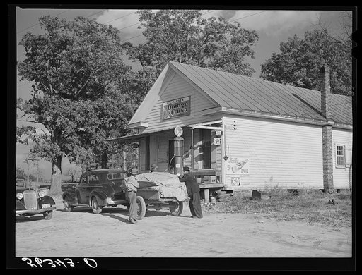 Untitled photo, possibly related to: Farmer with load of tobacco which he is taking to market to be sold at auction in warehouse. This is in front of Carver's store. Corbett Ridge section, Caswell County, North Carolina
