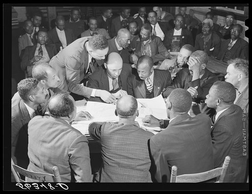 Untitled photo, possibly related to: Working on the county maps at the colored county land use planning committee meeting in the schoolhouse in Yanceyville. Caswell County, North Carolina. T.D. Williamson, Negro Caswell County extension agent is chairman of meeting