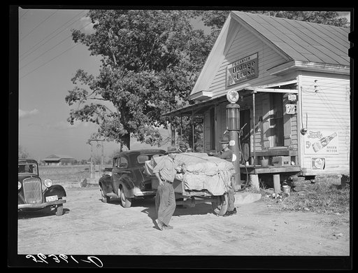 Farmer with load of tobacco which he is taking to market to be sold at auction in warehouse. This is in front of Carver's store. Corbett Ridge section, Caswell County, North Carolina
