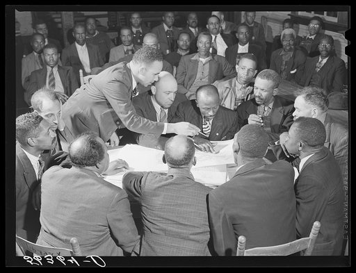 Working on the county maps at the colored county land use planning committee meeting in the schoolhouse in Yanceyville. Caswell County, North Carolina. T.D. Williamson, Negro Caswell County extension agent is chairman of meeting