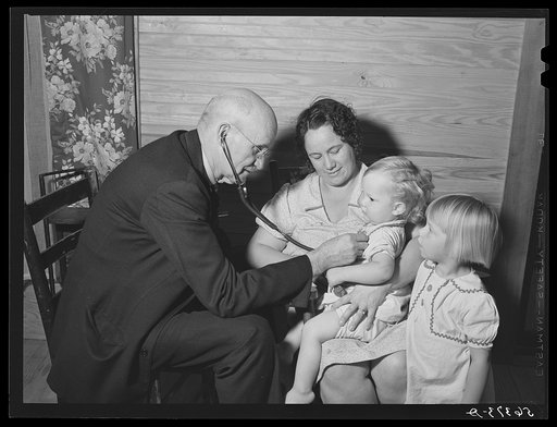 Dr. S.A. Malloy examining Mrs. William H. Willis and her family. Mr. Willis is a FSA (Farm Security Administration) borrower. Blanch, Caswell County, North Carolina