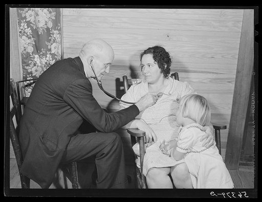 Dr. S.A. Malloy examining Mrs. William H. Willis and her family. Mr. Willis is a FSA (Farm Security Administration) borrower. Blanch, Caswell County, North Carolina