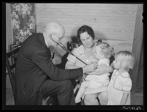 Untitled photo, possibly related to: Dr. S.A. Malloy examining Mrs. William H. Willis and her family. Mr. Willis is a FSA (Farm Security Administration) borrower. Blanch, Caswell County, North Carolina