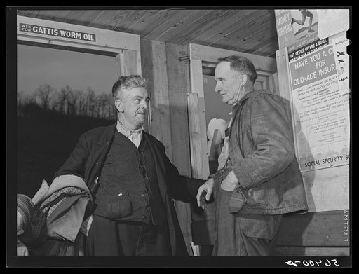 John Patterson and S.H. Castle inside Mr. Castle's store and post office. Southern Appalachian Project, Knox County, near Barbourville, Kentucky