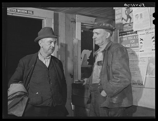 Untitled photo, possibly related to: John Patterson and S.H. Castle inside Mr. Castle's store and post office. Southern Appalachian Project, Knox County, near Barbourville, Kentucky