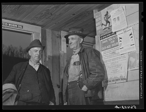 John Patterson and S.H. Castle inside Mr. Castle's store and post office. Southern Appalachian Project, Knox County, near Barbourville, Kentucky