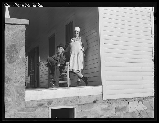 Josh Calahan and wife on the porch of their new home. Southern Appalachian Project near Barbourville, Knox County, Kentucky
