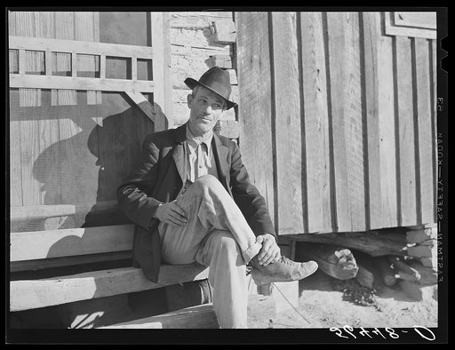 Untitled photo, possibly related to: Noah Garland sitting on the steps of his son's home. Southern Appalachian Project near Barbourville, Knox County, Kentucky