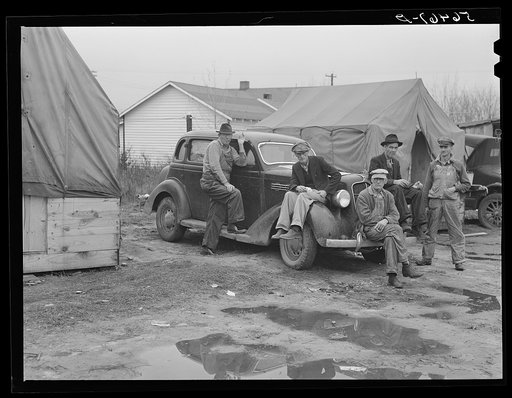 Men on car by tents. Construction workers in front of tents. Names: William Allen Jones, Fort Benning, Paul Knight, Fort Benning, J.F. Goza, C.D. Brownlee and B.I. Juhan. For space only in W.T. Mullis' backyard they pay two dollars a week. Two of them are now working at Fort Benning and others the W