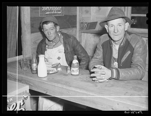 Construction workers from Camp Livingston eating and hanging around new cafe by entrance of camp. Alexandria, Louisiana
