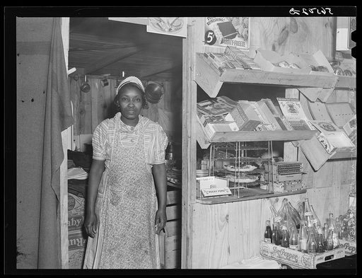 Negro girl in new cafe opposite entrance to Camp Livingston. Alexandria, Louisiana