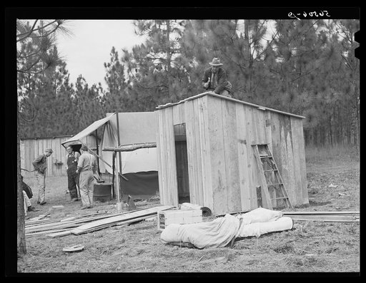 J.R. Jones from Monroe, Louisiana, building new shack to live in temporarily while works on construction job at Camp Livingstone near Fort Beauregard