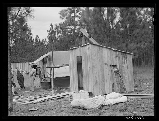 Untitled photo, possibly related to: J.R. Jones from Monroe, Louisiana, building new shack to live in temporarily while works on construction job at Camp Livingstone near Fort Beauregard