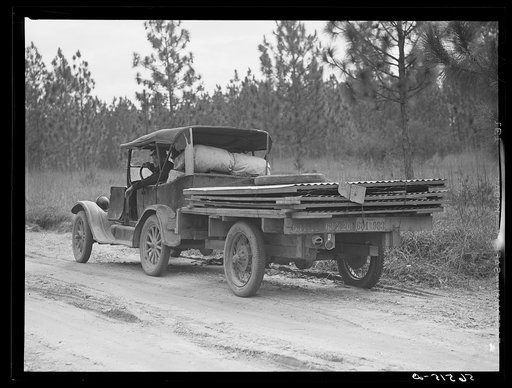Worker just arriving from southern Louisiana trying to get job on Camp Livingston. In back of his car he has a portable house. Alexandria, Louisiana
