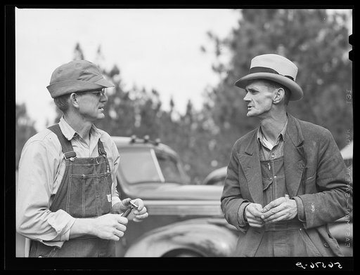 Untitled photo, possibly related to: Construction worker from Monroe, Louisiana. Sitting on car in front of his shack before leaving for evening shift. Camp Livingston, Alexandria, Louisiana