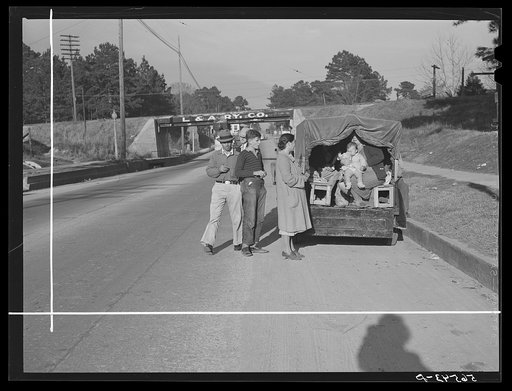Car converted into truck with benches for family and a carryall. Alexandria, Louisiana