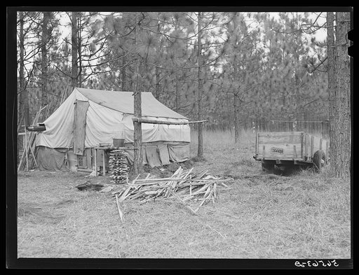 Camp Livingston construction worker's shack and tents near Fort Beauregard. These are along the main highway on government property so they do not have to pay rent. Most of the people cook outdoors and haul water from a nearby church faucet. There are no sanitary facilities and most of them have bro