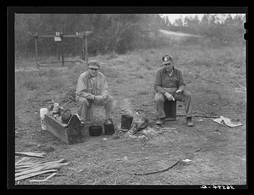Untitled photo, possibly related to: Two construction workers who sleep in car, cooking outdoors. One is from Memphis, Tennessee, and worked formerly on the construction of Dupont plant at Millington, Tennessee. The other is from Decatur, Mississippi, and worked previously at the Camp Shelby job, Ha