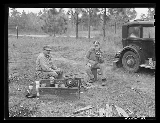 Two construction workers who sleep in car, cooking outdoors. One is from Memphis, Tennessee, and worked formerly on the construction of Dupont plant at Millington, Tennessee. The other is from Decatur, Mississippi, and worked previously at the Camp Shelby job, Hattiesburg, Mississippi. He said: "We 