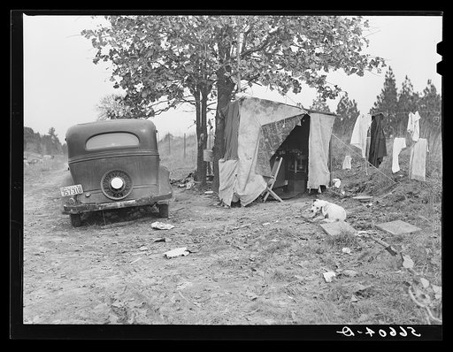 Construction worker's family from Texas sleeping in car; cook and eat in lean-to. Near Camp Claiborne, Alexandria, Louisiana