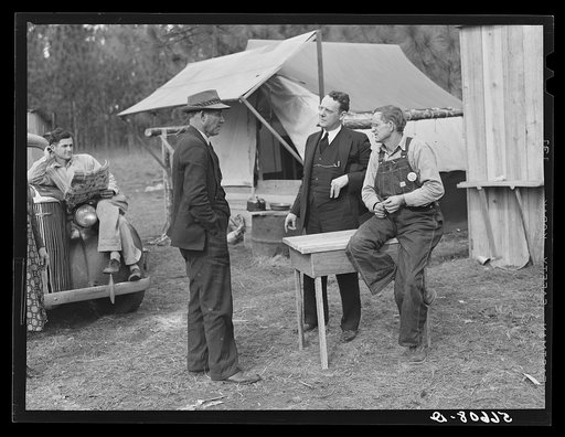 Travelling preacher, Reverend C.L. Bullard, with Jonathan Daniels and construction workers from Monroe, Louisiana. Alexandria, Louisiana