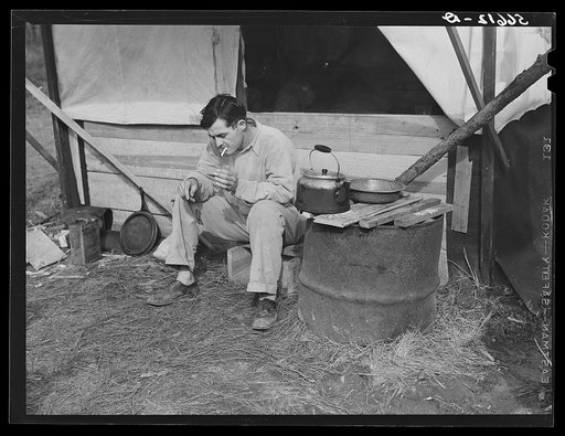 D.C. Lovelady in front of tent. He drives a truck at Camp Livingston construction job and is from Monroe, Louisiana