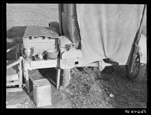 Tent, car, and farm truck, used for sleeping and general housing by construction workers off highway near Camp Claiborne, Louisiana. Cook out of doors and have no sanitary conveniences