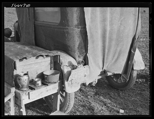 Untitled photo, possibly related to: Tent, car, and farm truck, used for sleeping and general housing by construction workers off highway near Camp Claiborne, Louisiana. Cook out of doors and have no sanitary conveniences
