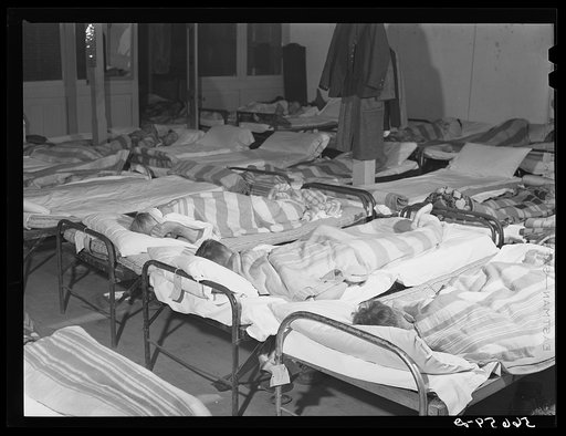 Untitled photo, possibly related to: Flophouse of about thirty-seven beds at fifty cents each, constantly crowded with construction workers sleeping in several shifts. Some of them had flu. Alexandria, Louisiana