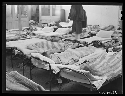 Untitled photo, possibly related to: Flophouse of about thirty-seven beds at fifty cents each, constantly crowded with construction workers sleeping in several shifts. Some of them had flu. Alexandria, Louisiana