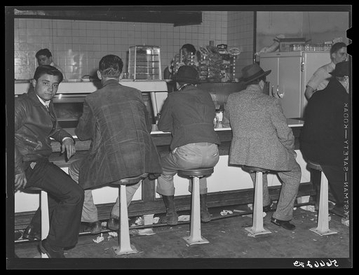 Construction workers eating in cafe in Alexandria, Louisiana. They say food is up at least one third, often prices double for meals