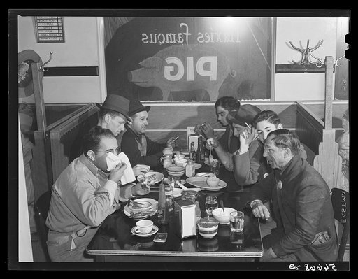 Construction workers eating in cafe in Alexandria; they say food is up at least one third. Often prices doubled for meals