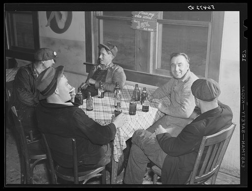 Finnish construction workers from New York, drinking beer and spending their leisure time in a new cafe near Camp Blanding. They were unable to work because of the heavy rains. Starke, Florida