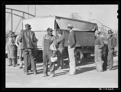 Untitled photo, possibly related to: Negro construction workers waiting by truck to go to work on Camp Livingston jobs. Alexandria, Louisiana