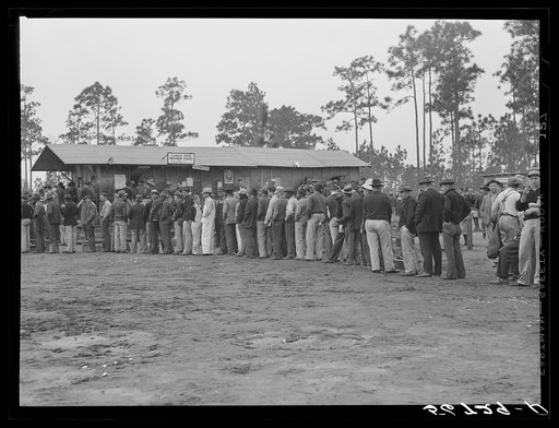 Untitled photo, possibly related to: Carpenters and construction workers waiting outside Florida state employment office trying to get jobs on Camp Blanding. Starke, Florida