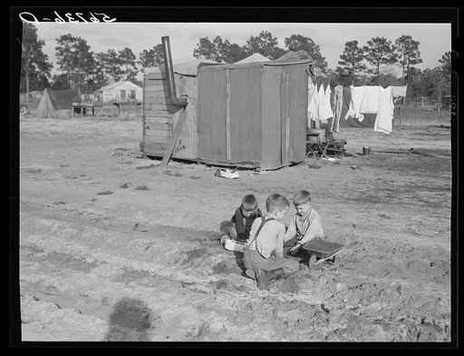Construction worker's children playing in front of their shacks and tents near Camp Blanding. Starke, Florida