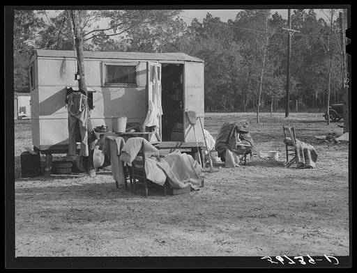 Construction workers drying out bedding and mattresses from their trailer after a week of heavy rains and winds. Near Camp Livingston, Alexandria, Louisiana