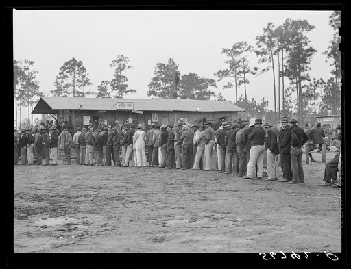 Carpenters and construction workers waiting outside Florida state employment office trying to get jobs on Camp Blanding. Starke, Florida