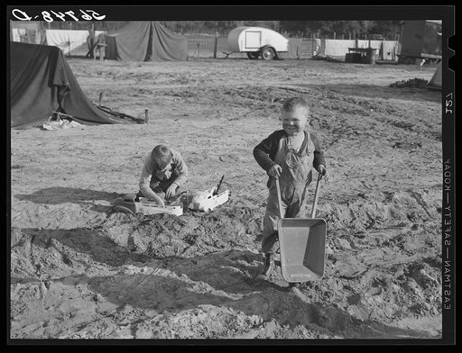 Untitled photo, possibly related to: Construction worker's children playing in front of their shacks and tents near Camp Blanding. Starke, Florida
