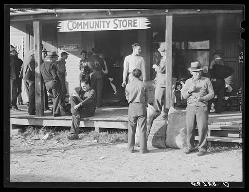 Untitled photo, possibly related to: Spanish trappers and fur buyers waiting around while muskrats are being graded during auction sale on porch of community store. Saint Bernard, Louisiana