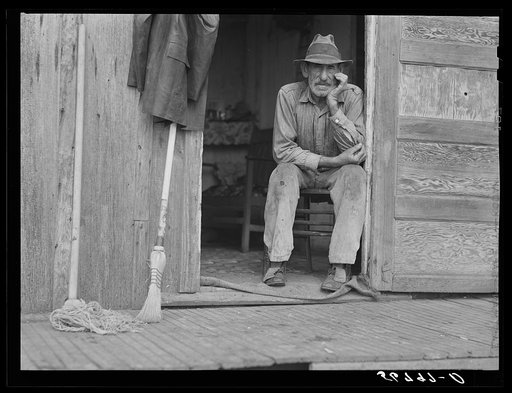 Untitled photo, possibly related to: Spanish muskrat trapper in doorway of his marsh camp. Delacroix Island, Saint Bernard Parish, Louisiana