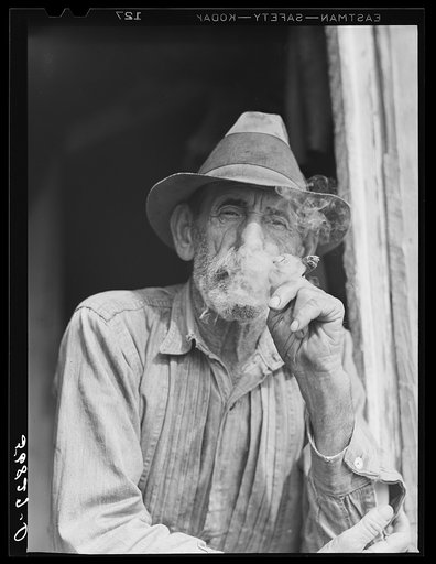 Untitled photo, possibly related to: Spanish muskrat trapper in doorway of his marsh camp. Delacroix Island, Saint Bernard Parish, Louisiana