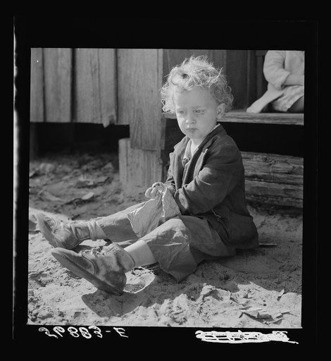 Untitled photo, possibly related to: Child of construction worker who had been employed on Camp Blanding job. Starke, Florida