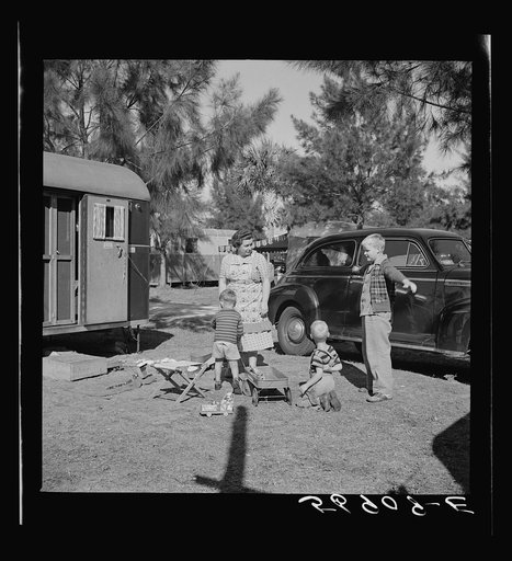 Children and their mother outside their trailer home. Sarasota trailer park, Sarasota, Florida