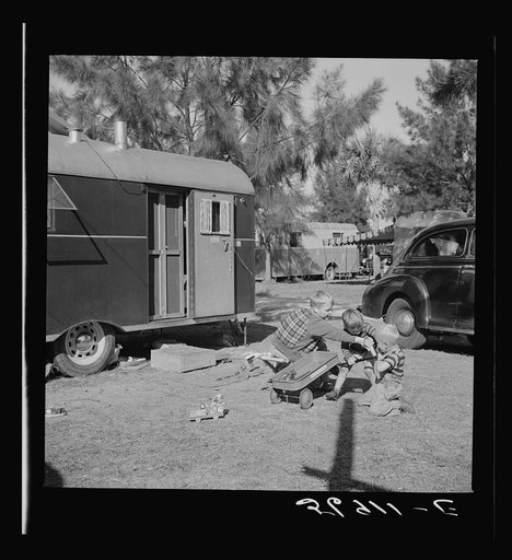 Untitled photo, possibly related to: Children and their mother outside their trailer home. Sarasota trailer park, Sarasota, Florida