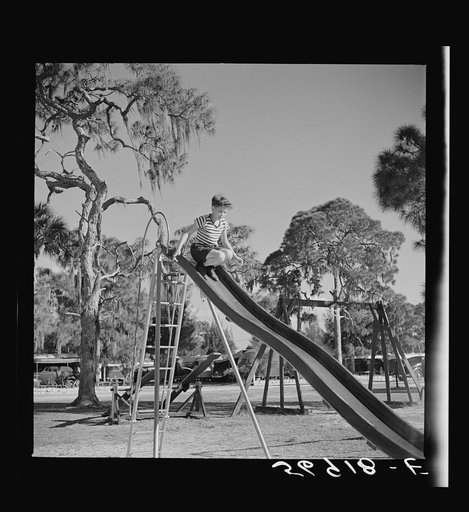 Untitled photo, possibly related to: Playing in the playground in Sarasota trailer park. Sarasota, Florida